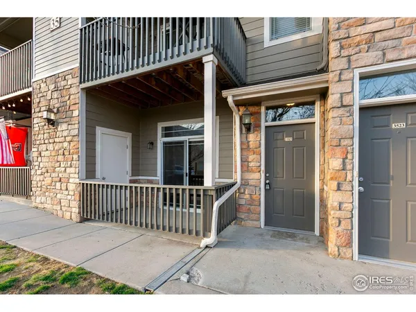 a view of a house with a door and wooden floor