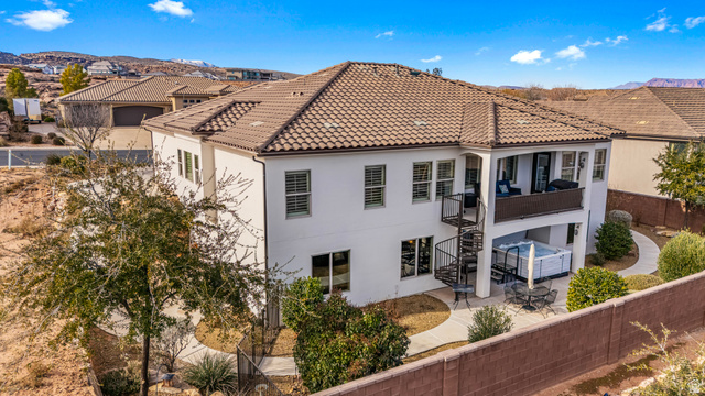 2311 South 1340 West St. George, UT 84770 - Photo 6 of 56 Back of property featuring a fenced backyard, a balcony, stucco siding, a tiled roof, and a patio
