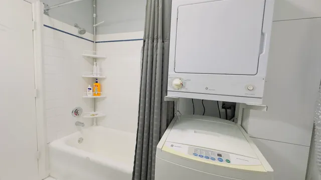 a bathroom with a tub and shower