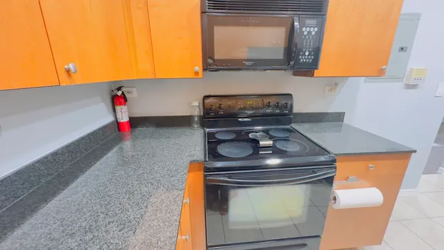 a kitchen with a stove and a microwave