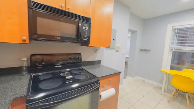 a kitchen with a stove and a microwave
