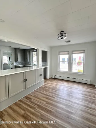 a view of a kitchen with sink stainless steel appliances and cabinets