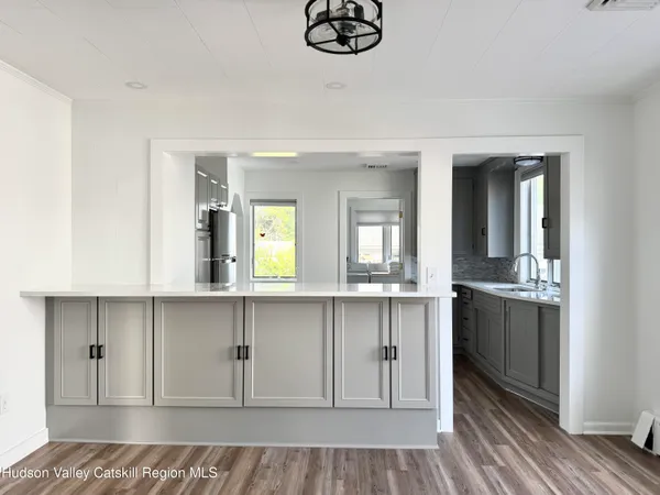 a spacious bathroom with a sink and a mirror