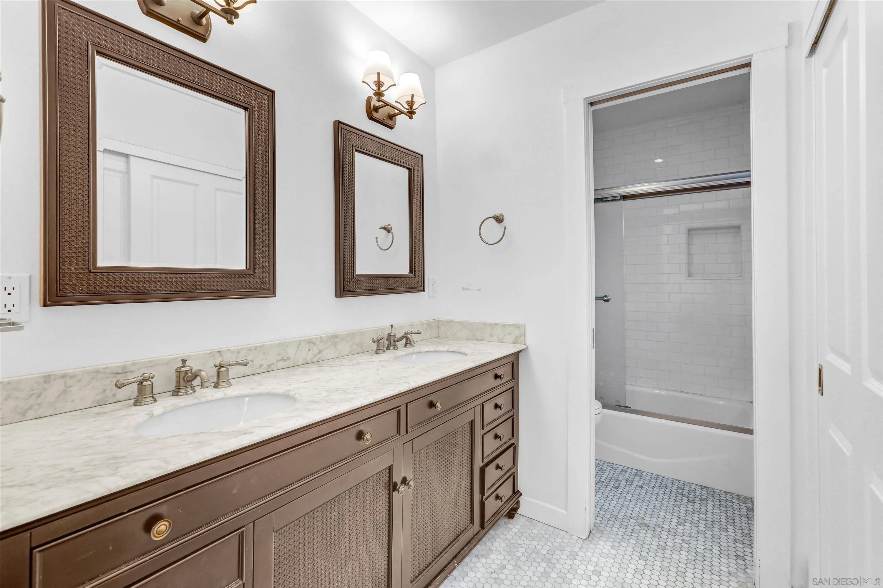 3335 Riviera Drive San Diego, CA 92109 - Photo 13 of 22 a bathroom with a granite countertop sink mirror and double