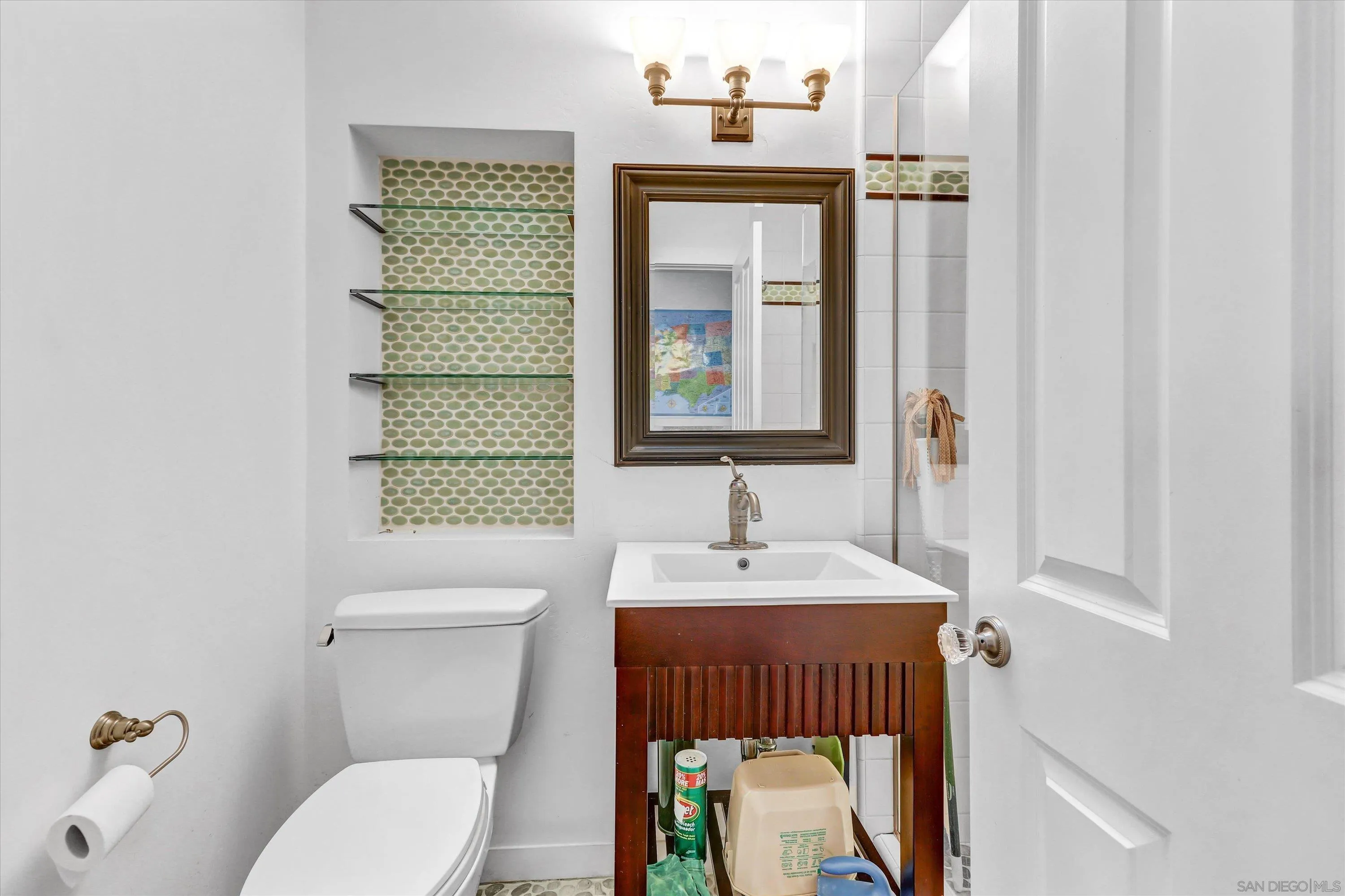 3335 Riviera Drive San Diego, CA 92109 - Photo 15 of 22 a bathroom with a toilet a sink and a window