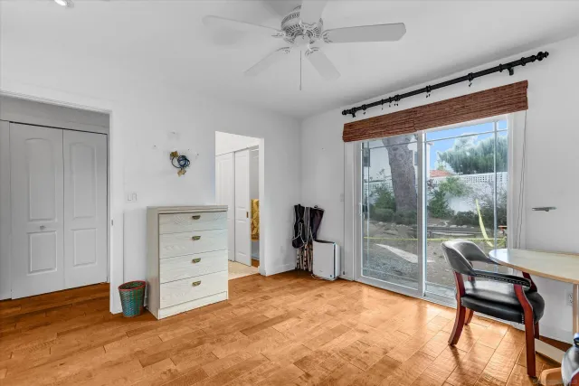 a view of a room with furniture and a window
