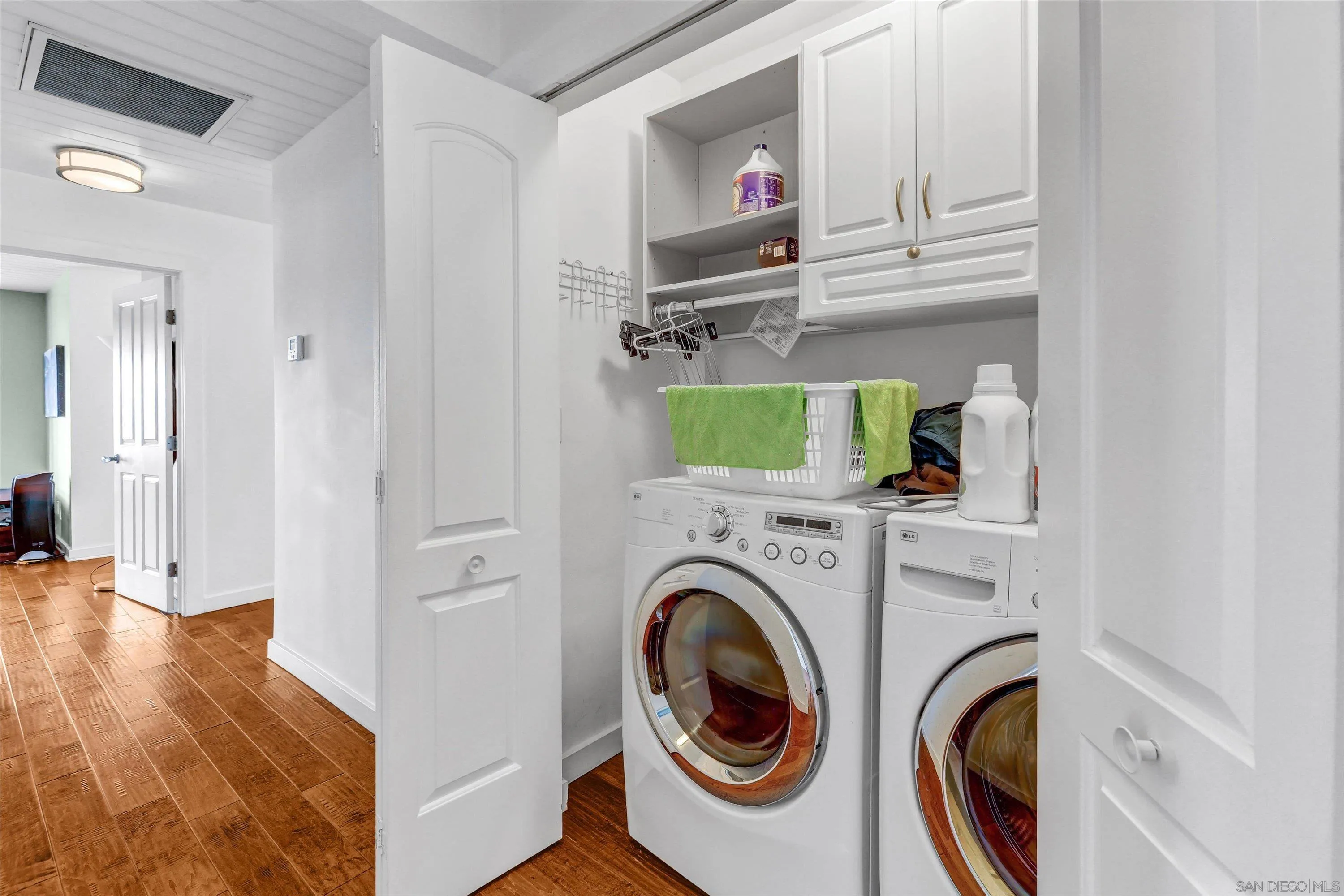 3335 Riviera Drive San Diego, CA 92109 - Photo 19 of 22 a view of a storage & utility room with wooden floor