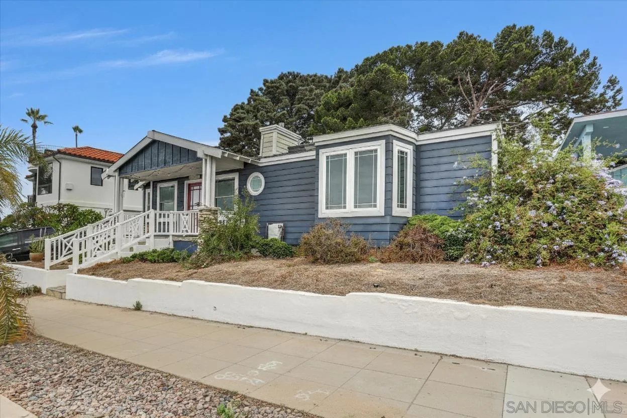 3335 Riviera Drive San Diego, CA 92109 - Photo 20 of 22 front view of a house with a yard