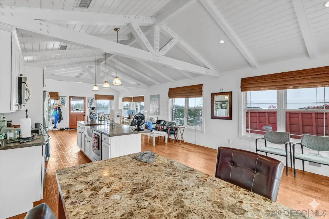 3335 Riviera Drive San Diego, CA 92109 - Photo 8 of 22 a living room with furniture and a flat screen tv