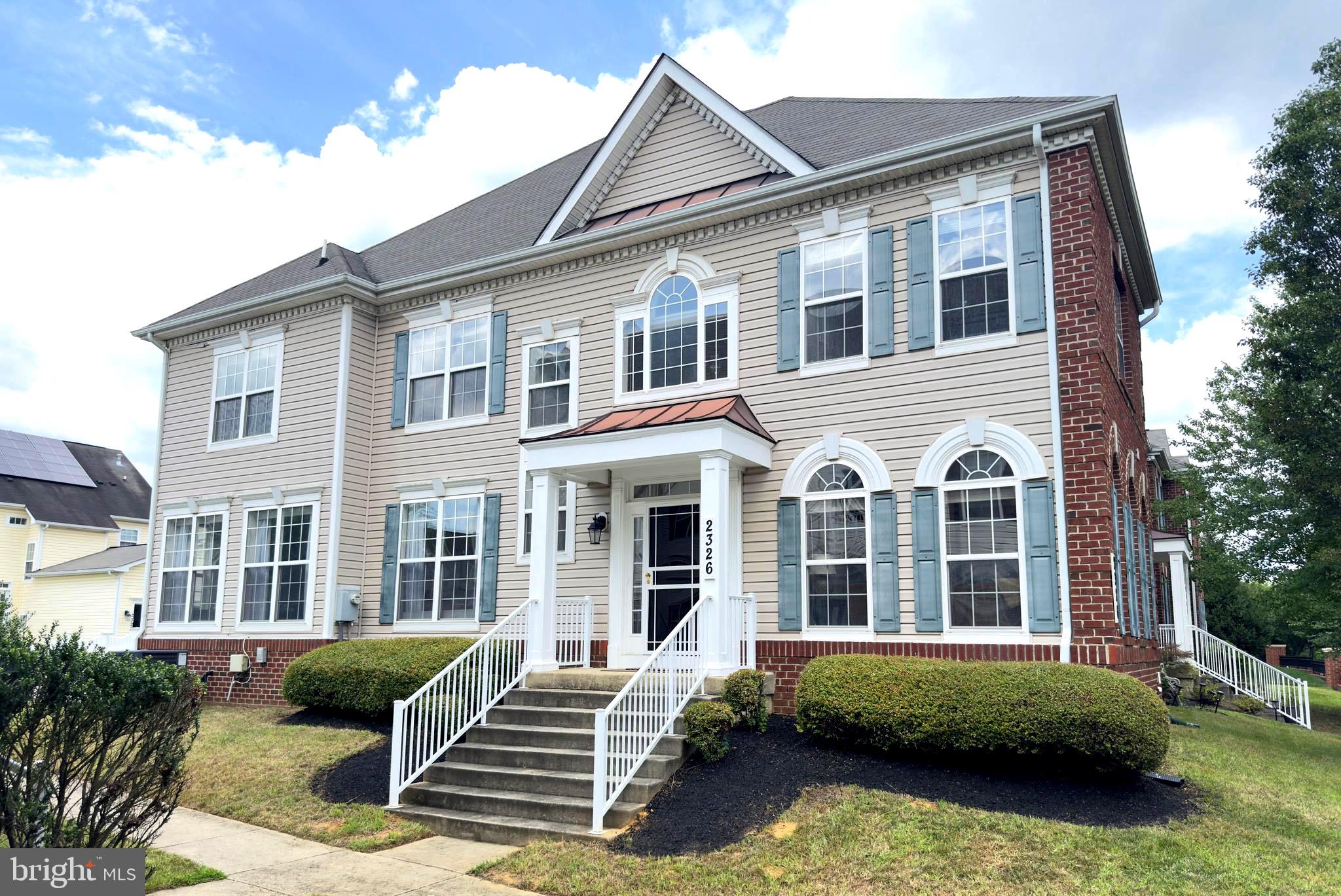 2326 Campus Way North Bowie, MD 20721 - Photo 1 of 31 a front view of a house with garden and porch