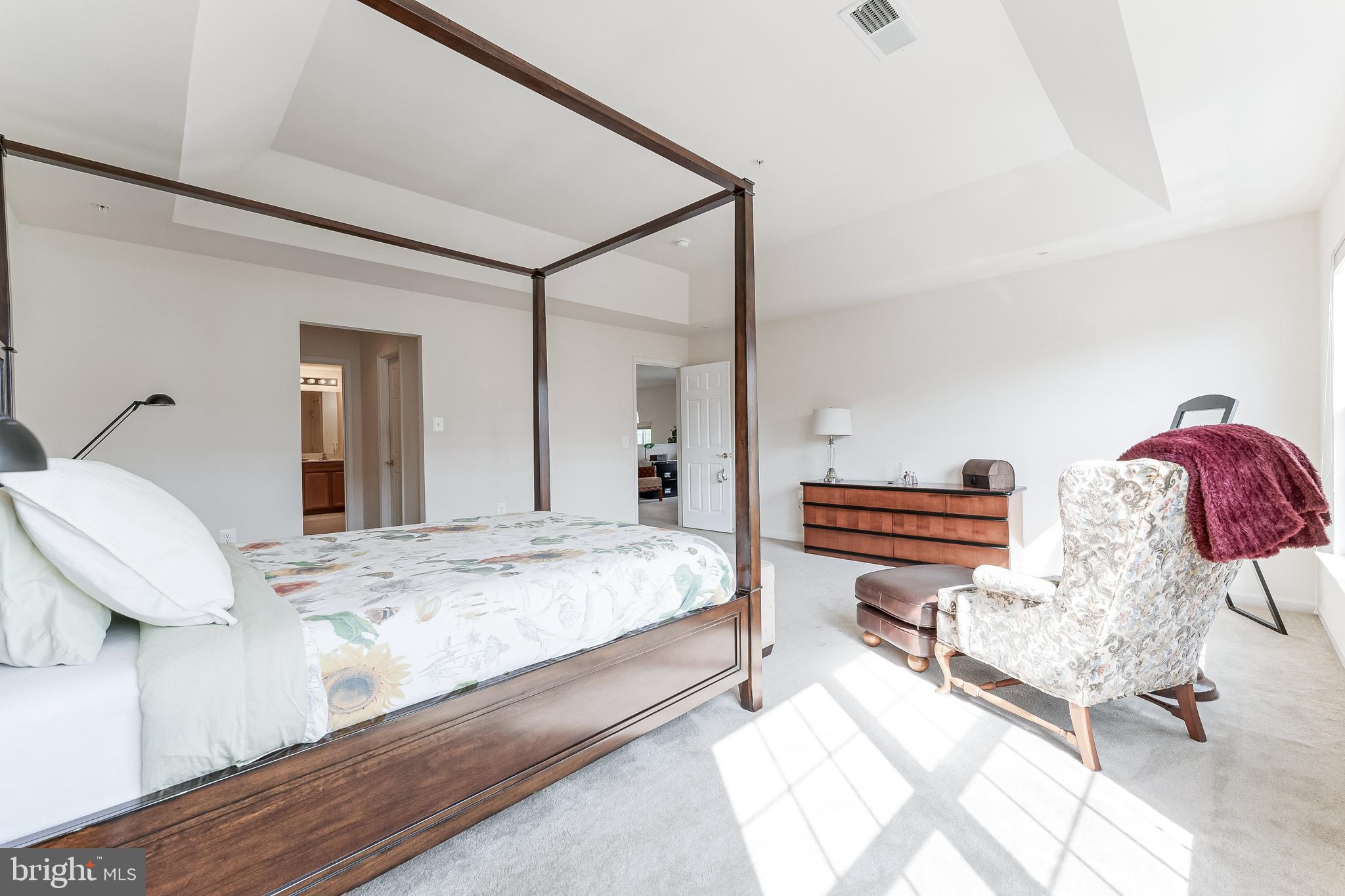 2326 Campus Way North Bowie, MD 20721 - Photo 14 of 31 a bedroom with a bed and dresser with wooden floor
