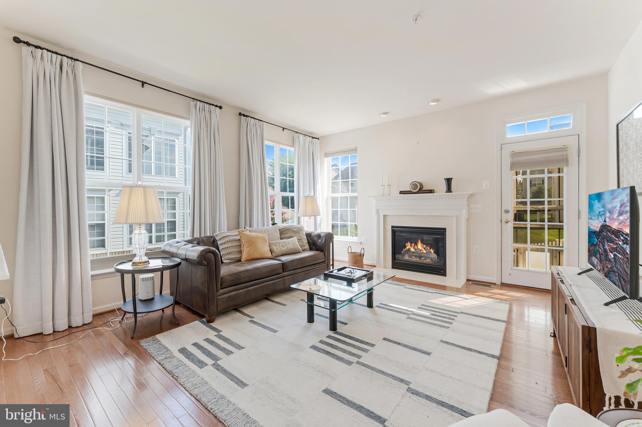 2326 Campus Way North Bowie, MD 20721 - Photo 8 of 31 a living room with furniture and a fireplace