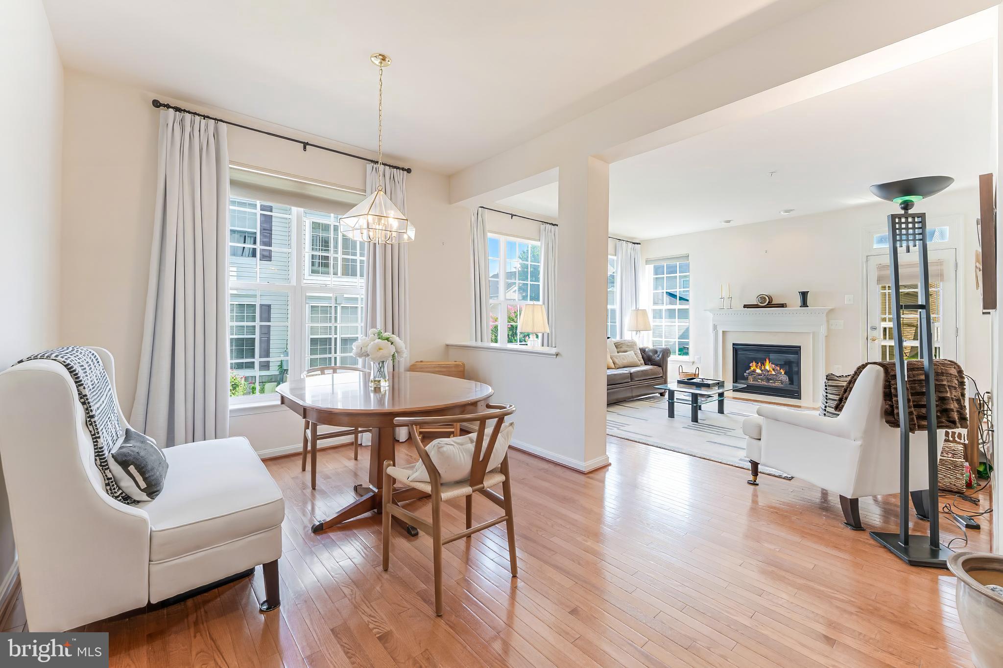 2326 Campus Way North Bowie, MD 20721 - Photo 9 of 31 a living room with fireplace furniture and a wooden floor