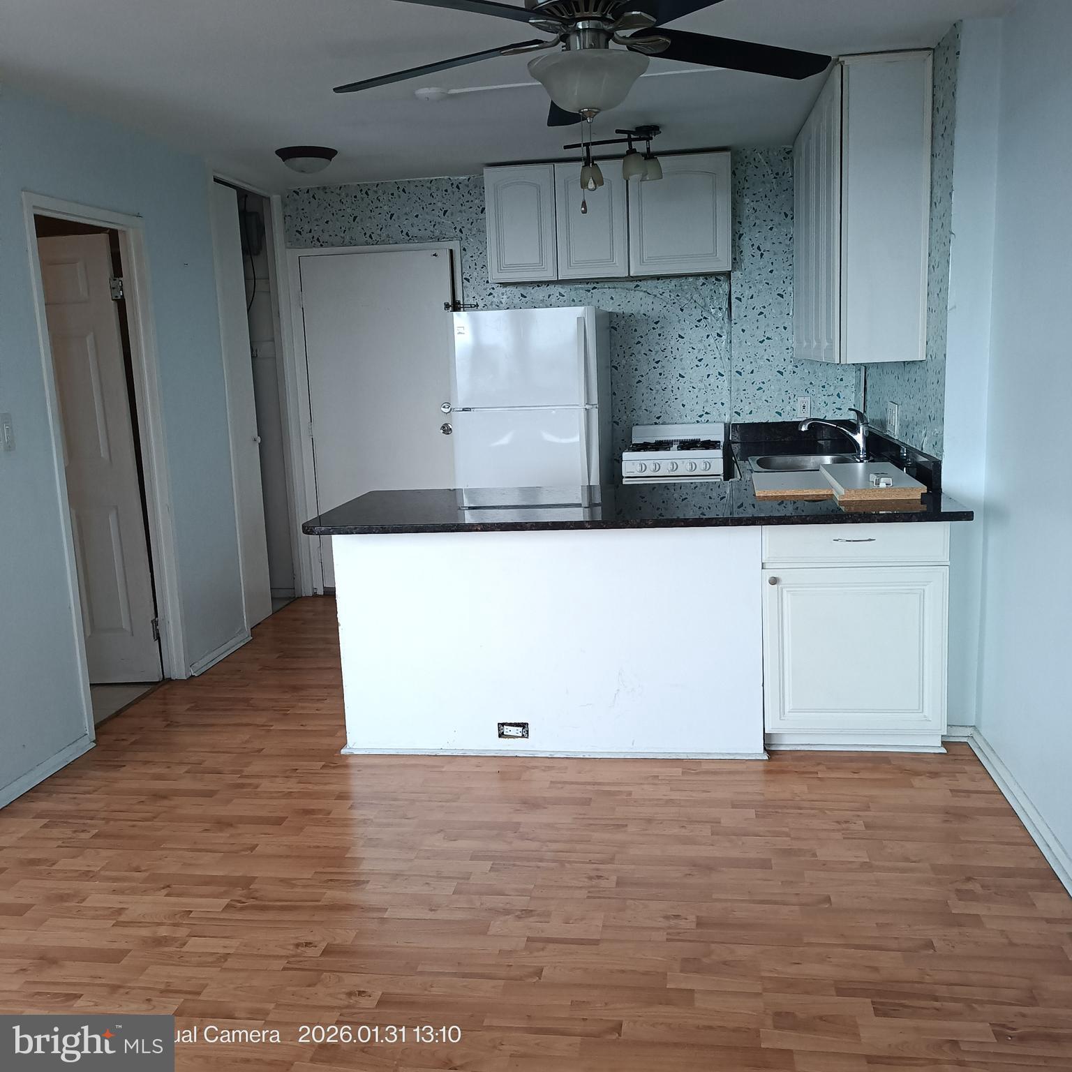 2800 Wisconsin Avenue Northwest, Unit 809 Washington, DC 20007 - Photo 5 of 6 a kitchen with a wooden floor and window