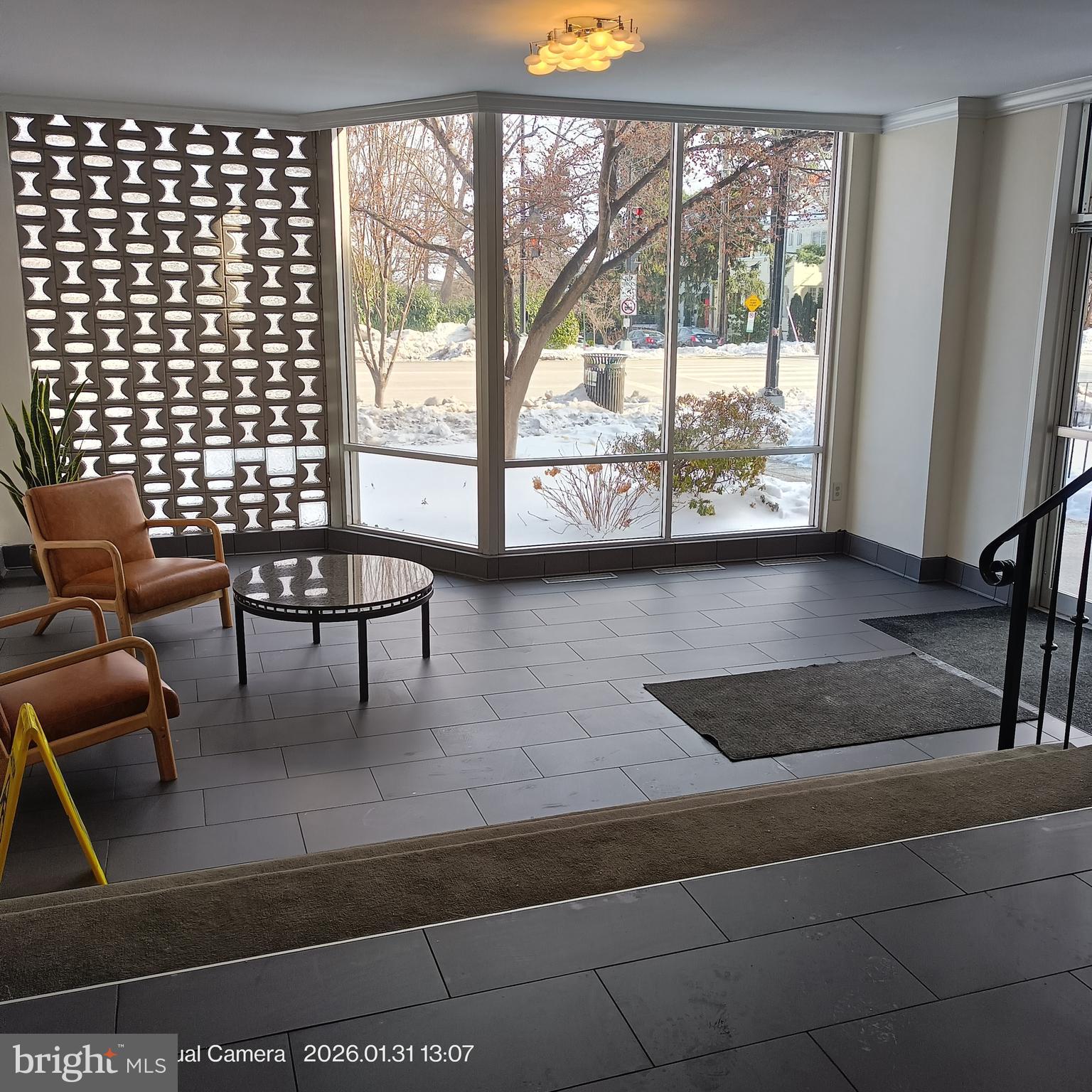 2800 Wisconsin Avenue Northwest, Unit 809 Washington, DC 20007 - Photo 6 of 6 a living room with furniture and a large window