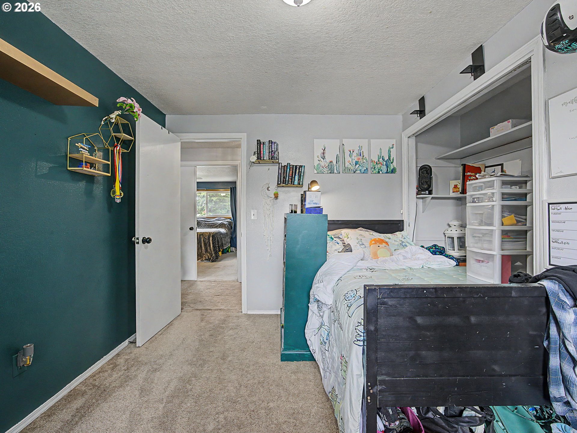 18015 Davis Street Sandy, OR 97055 - Photo 24 of 40 a bed sitting in a bedroom next to a window