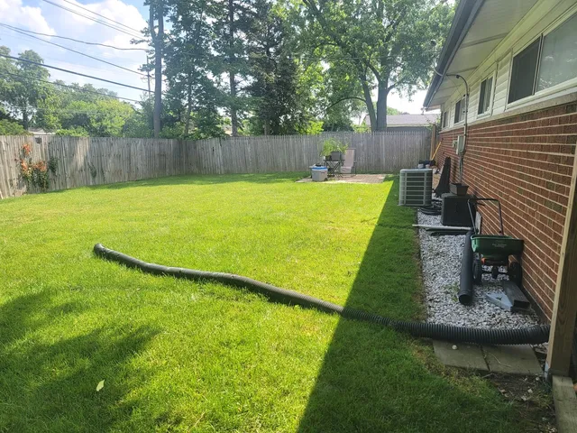 a view of a backyard with a small pool