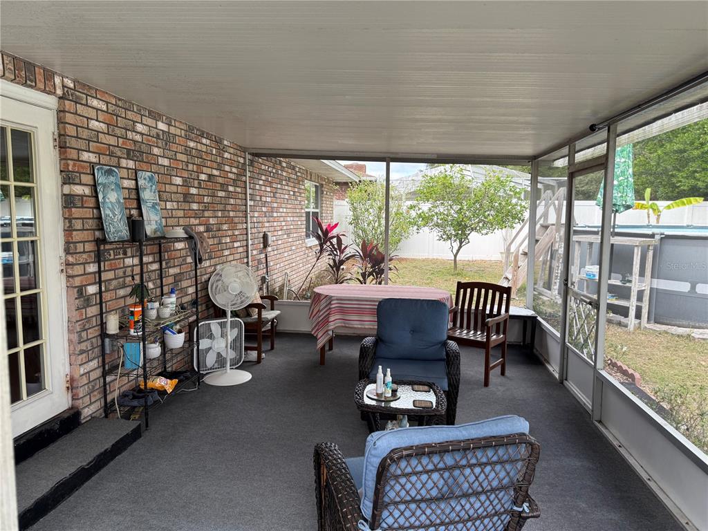 4007 Truman Drive Seffner, FL 33584 - Photo 15 of 17 a balcony with furniture and a potted plant
