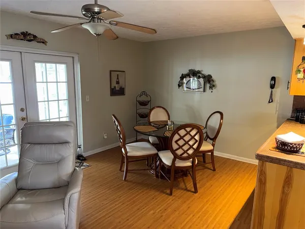 a kitchen with a sink a refrigerator and microwave