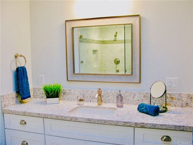 a bathroom with sink and mirror
