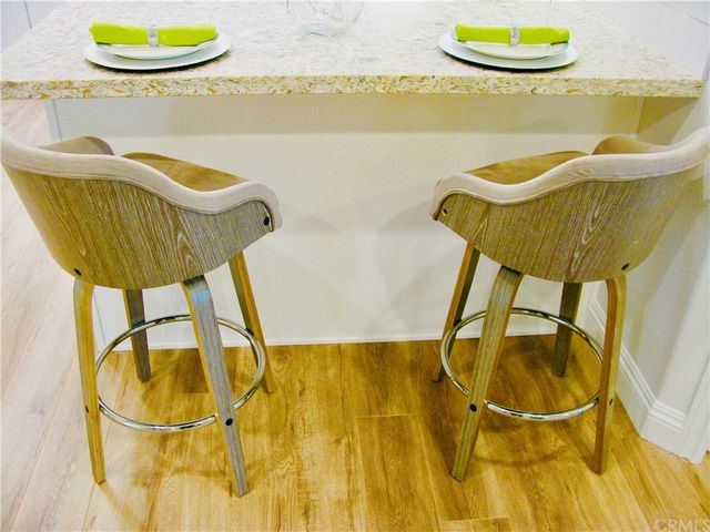 a view of swimming pool with a table and chairs