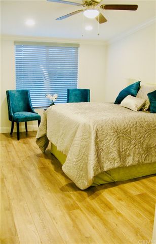 a bed sitting in a bedroom and a table