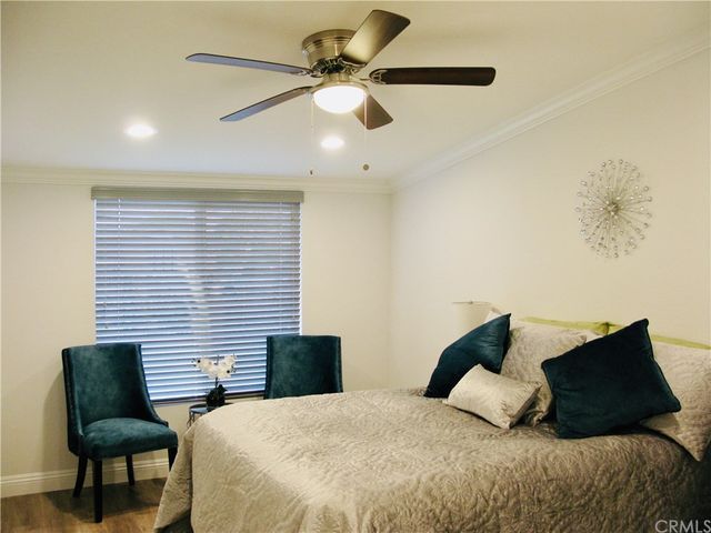 a bedroom with a bed furniture and a window