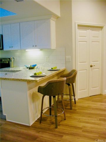 a kitchen with a table and chairs in it
