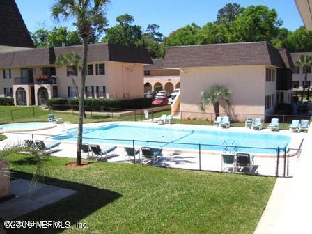 1530 El Prado Road, Unit 6 Jacksonville, FL 32216 - Photo 2 of 8 an aerial view of a house with a yard