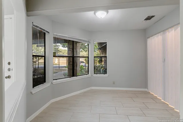 a view of cabinets and window