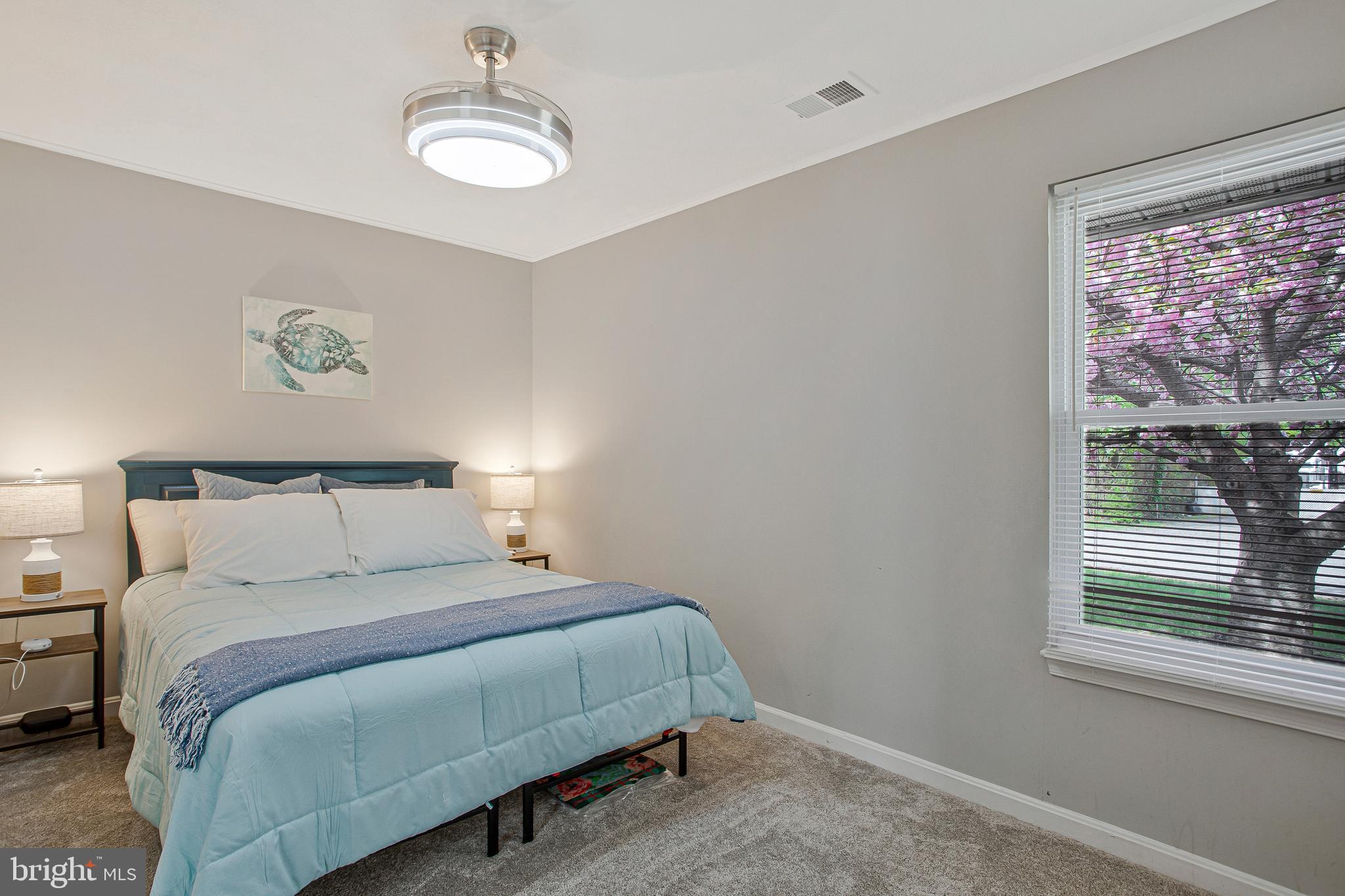 114 River Road Edgewater, MD 21037 - Photo 23 of 30 a bedroom with a bed and a window