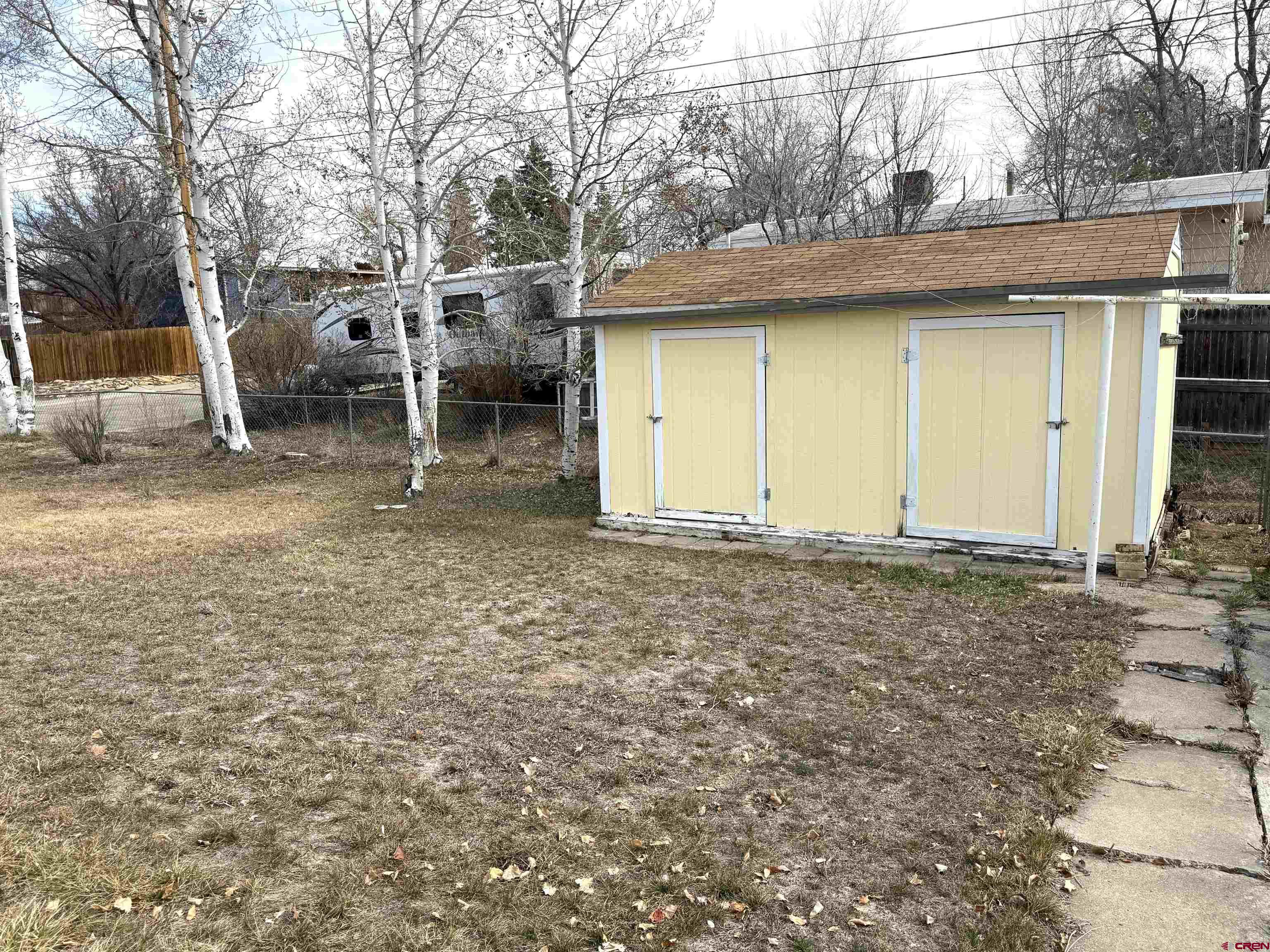 801 East 3rd Street Cortez, CO 81321 - Photo 17 of 22 a view of a house with a backyard