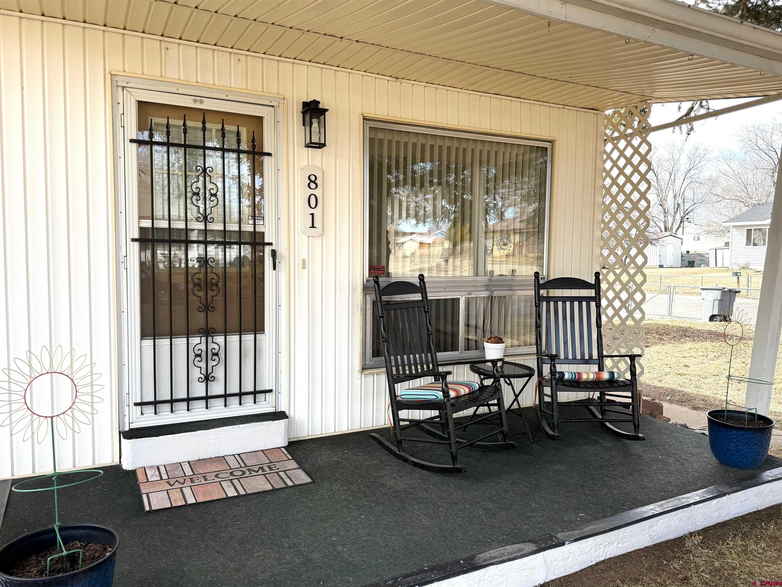 801 East 3rd Street Cortez, CO 81321 - Photo 2 of 22 a living room with furniture and large window