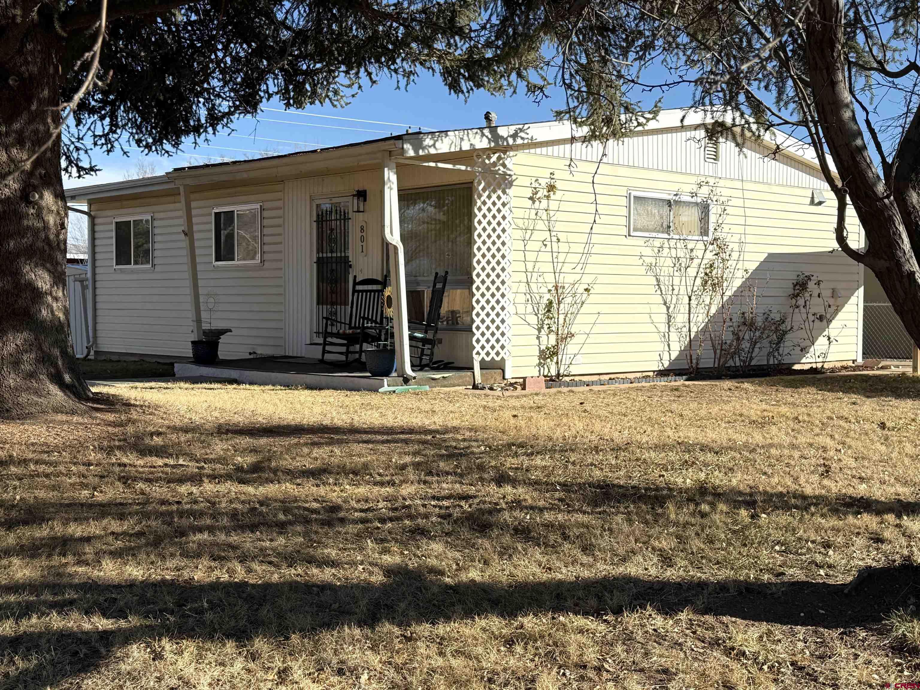 801 East 3rd Street Cortez, CO 81321 - Photo 3 of 22 a view of a house with a yard