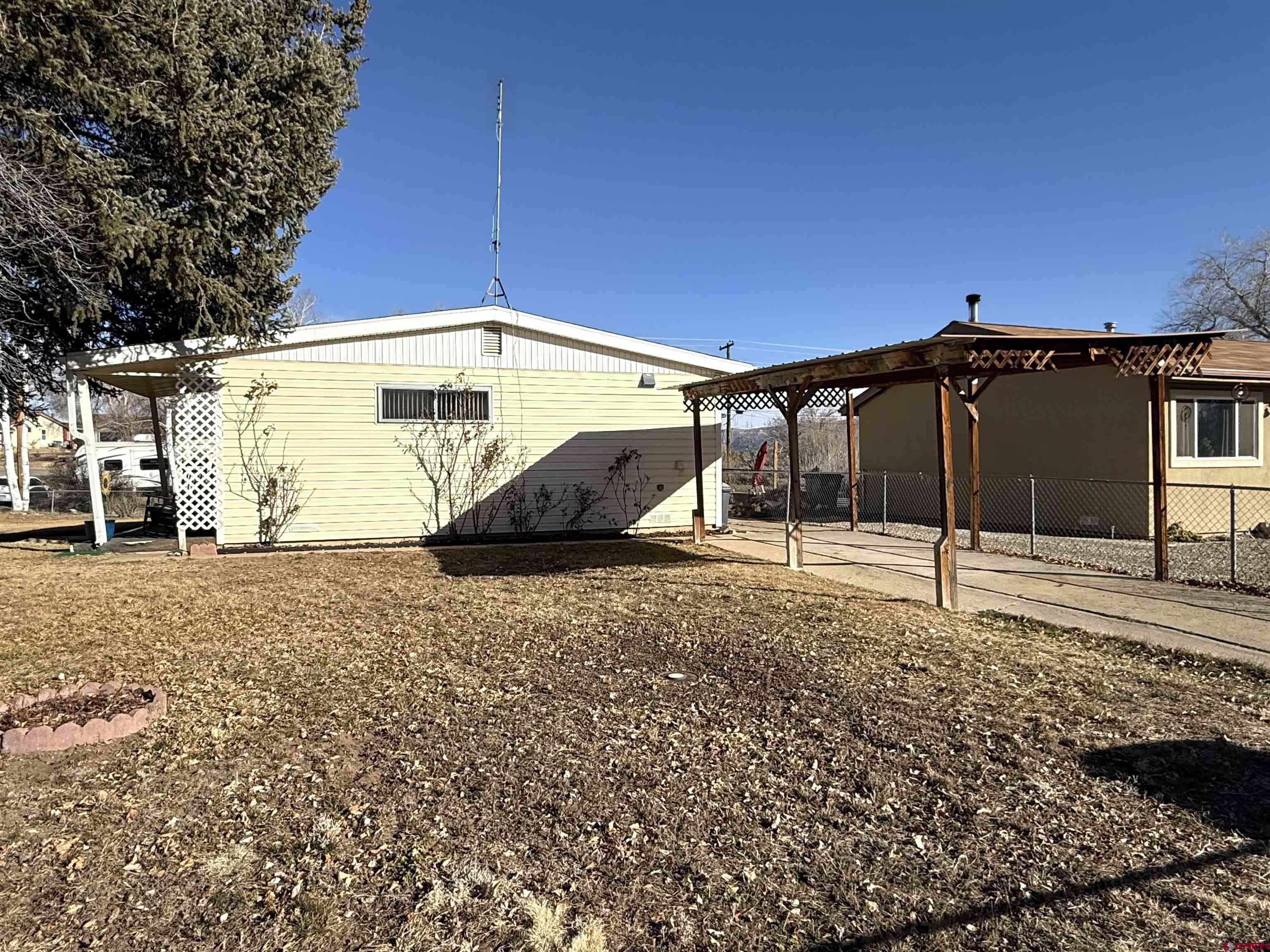 801 East 3rd Street Cortez, CO 81321 - Photo 8 of 22 a house view with a backyard space