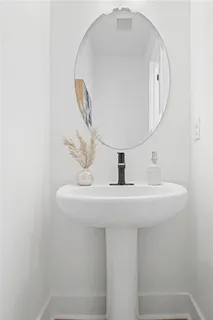 a bathroom with a sink and mirror