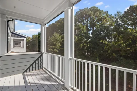a view of a balcony with wooden floor