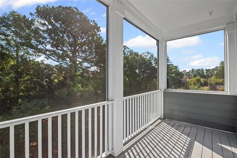 a view of a balcony with wooden floor