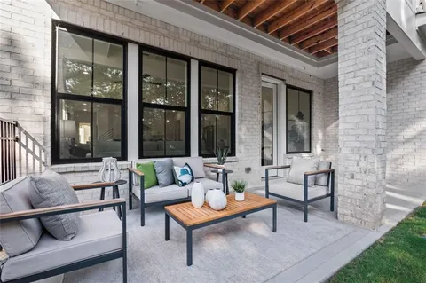 a outdoor space with patio the couches and a dining table with garden view