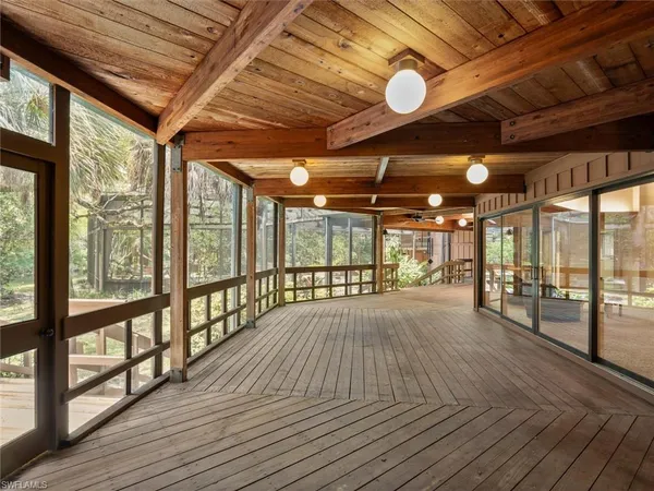 a view of balcony with wooden floor
