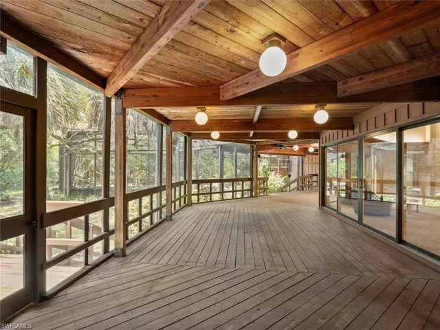 a view of balcony with wooden floor