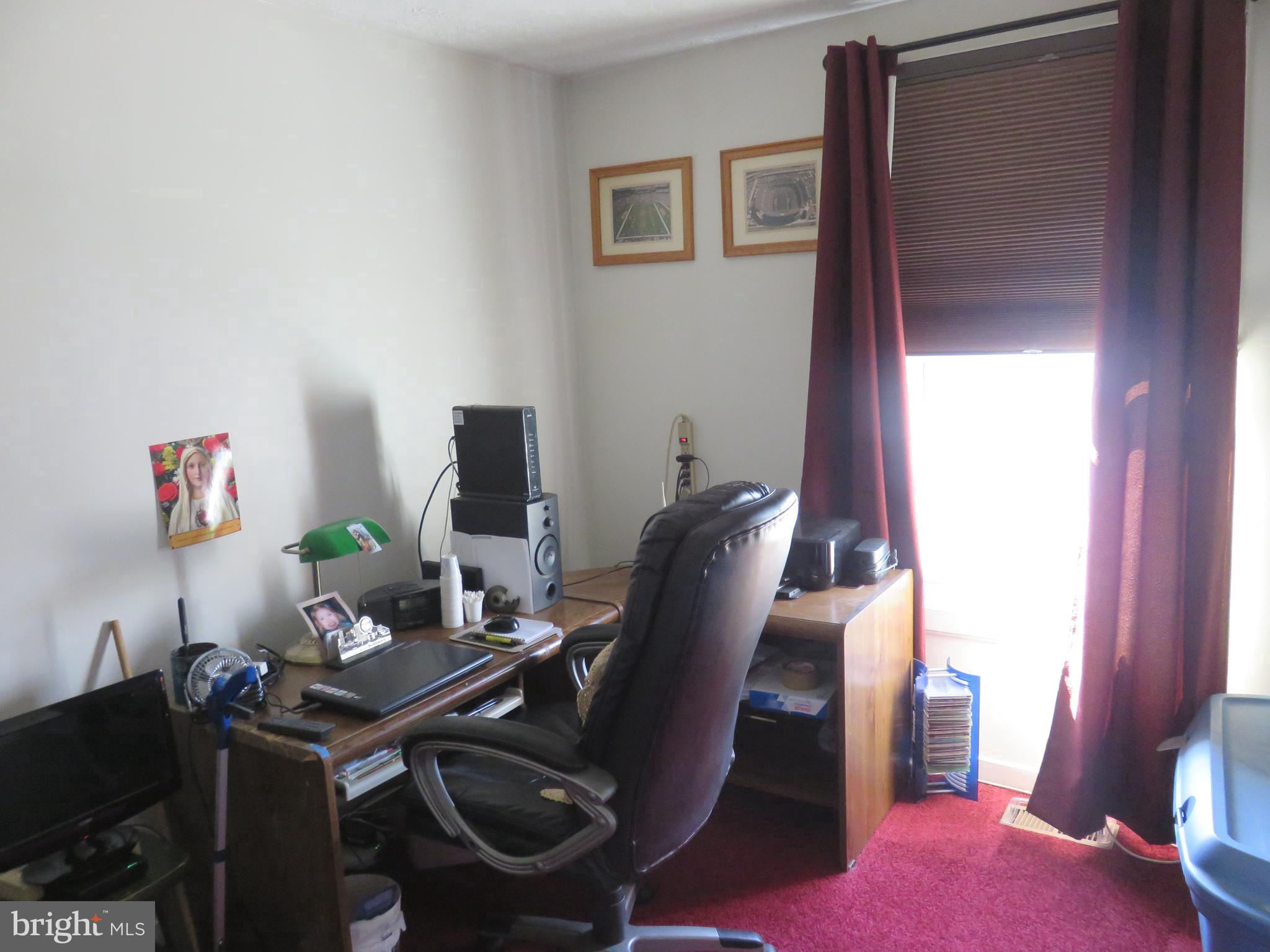 6823 Fordcrest Road Baltimore, MD 21237 - Photo 21 of 32 a view of a workspace with furniture and a window