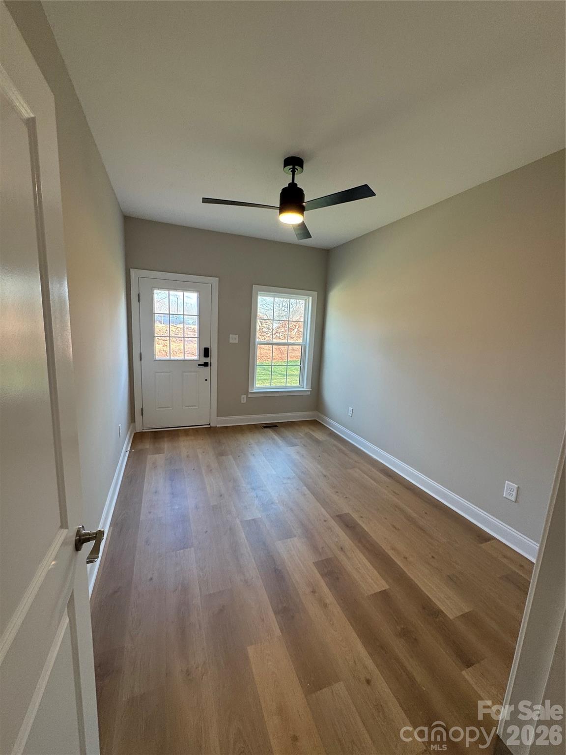 203 Lee Street Fort Mill, SC 29715 - Photo 13 of 19 wooden floor in an empty room with a window