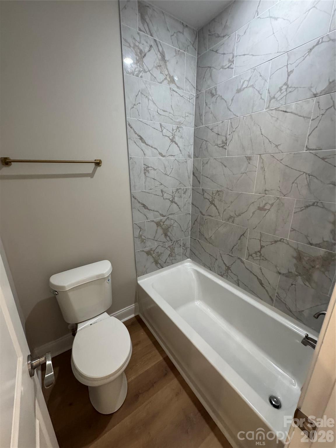 203 Lee Street Fort Mill, SC 29715 - Photo 17 of 19 a bathroom with a toilet and a bathtub