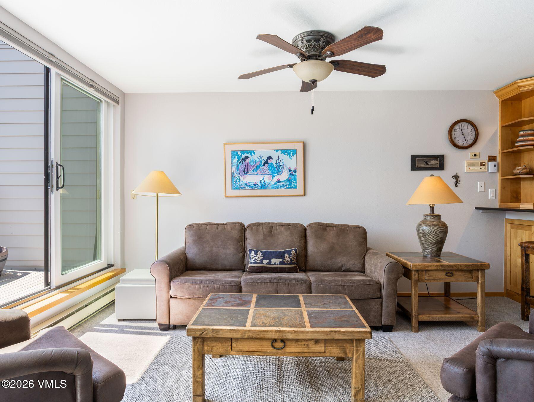 1100 North Frontage Road West, Unit 1503 Vail, CO 81657 - Photo 11 of 32 a living room with furniture a rug and a window