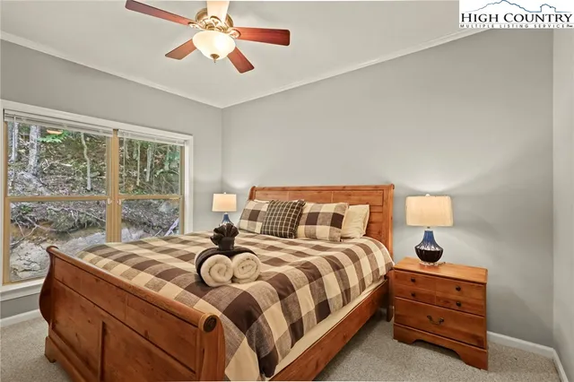 a bedroom with a bed and window