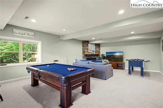 a dining room with a table and chairs