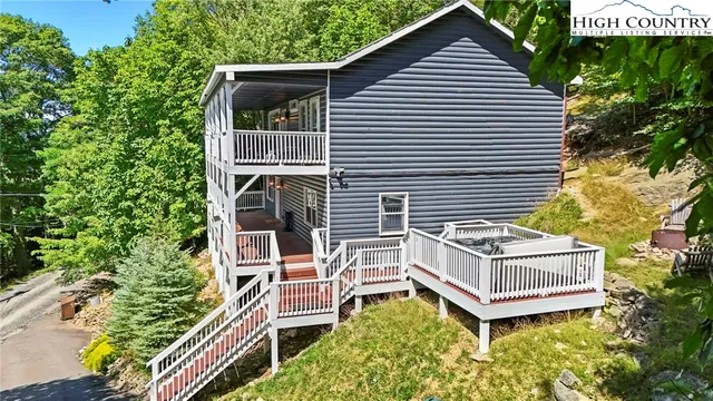 aerial view of a house with balcony and garden