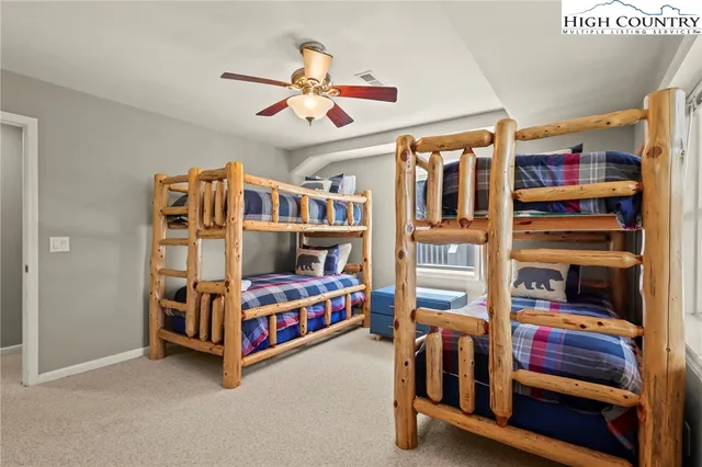 a bedroom with bunk beds and a window