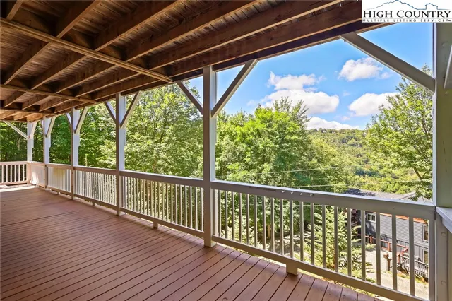 a view of balcony with wooden floor